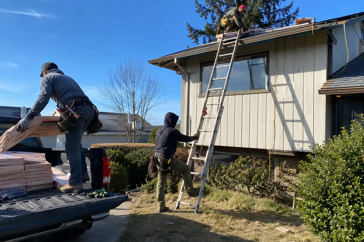 Roofing crew working on a property in Kent, WA